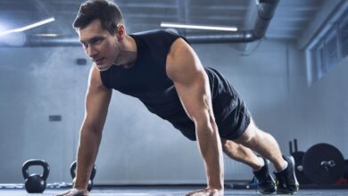 man doing a push up in the gym