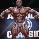 As Bodybuilding Beast ‘The Nigerian Lion’ Poses With His Shredded Physique, Fitness Trainer Is Convinced of His Victory at Olympia This Year