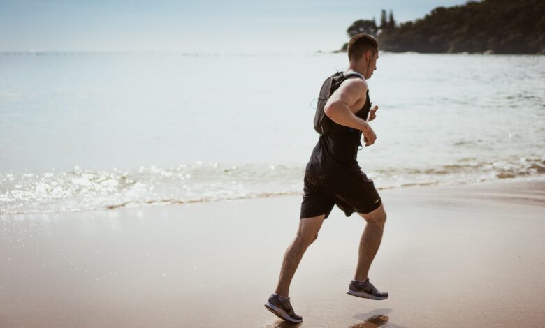 a man running on the beach