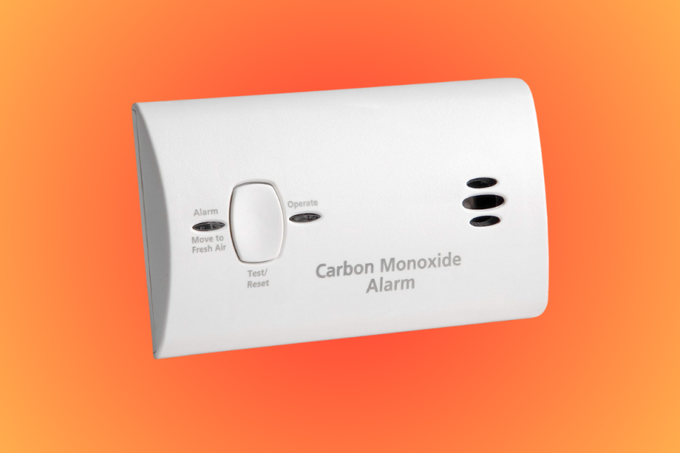 the Kidde carbon monoxide detector on an orange background