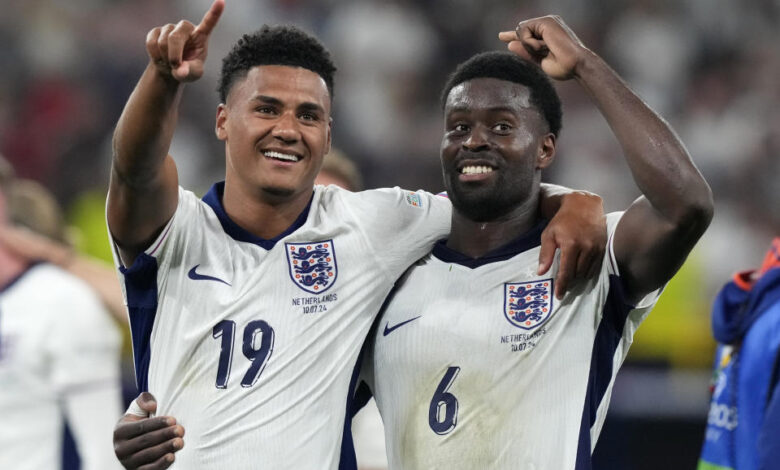 England's Ollie Watkins, left, celebrates with England's Marc Guehi after winning a semifinal match between the Netherlands and England at the Euro 2024 soccer tournament in Dortmund, Germany, Wednesday, July 10, 2024. (AP Photo/Frank Augstein)