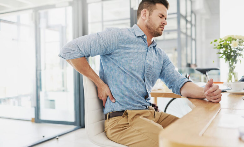 Should you 'fix' your posture? Why experts say always sitting up straight won't help your back pain.