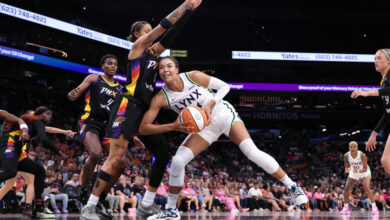 PHOENIX, ARIZONA - AUGUST 28: Kayla McBride #21 of the Minnesota Lynx maneuvers past Natasha Cloud #0 of the Phoenix Mercury in a riveting first-half duel at the Footprint Center on August 28, 2024. The Lynx triumphed over the Mercury 89-76. NOTE TO USER: By downloading or using this photograph, user acknowledges and agrees to the Getty Images License Agreement. (Photo by Chris Coduto/Getty Images)