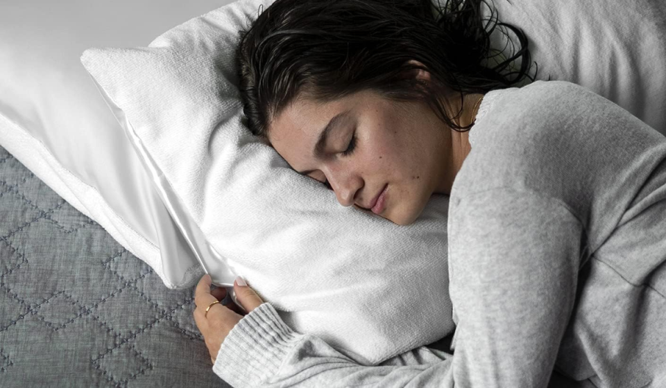 woman sleeping on a white DryZzz pillowcase