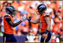 DENVER, COLORADO - OCTOBER 13:  Troy Franklin #16 and Bo Nix #10 of the Denver Broncos celebrate after a fourth quarter touchdown against the Los Angeles Chargers at Empower Field at Mile High on October 13, 2024 in Denver, Colorado. (Photo by Dustin Bradford/Getty Images)