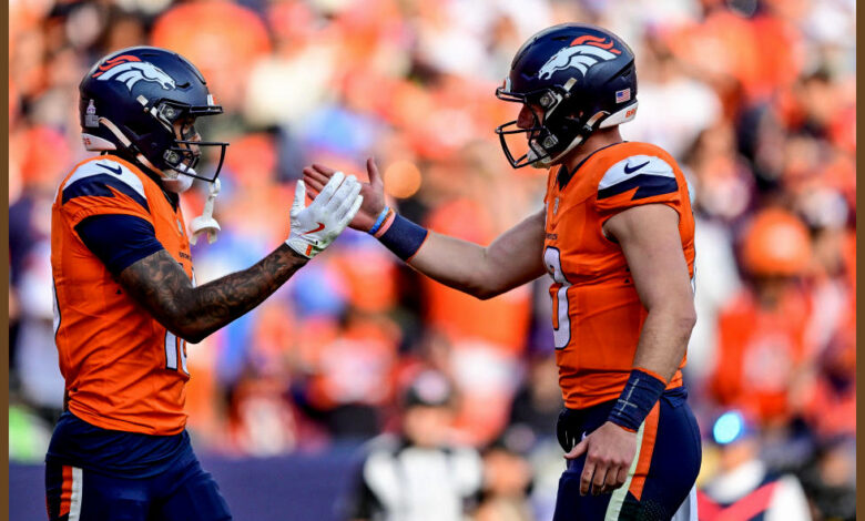 DENVER, COLORADO - OCTOBER 13:  Troy Franklin #16 and Bo Nix #10 of the Denver Broncos celebrate after a fourth quarter touchdown against the Los Angeles Chargers at Empower Field at Mile High on October 13, 2024 in Denver, Colorado. (Photo by Dustin Bradford/Getty Images)